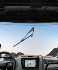 Heavy Duty Manual UTV Windshield Wiper Kit with 16-inch blade visible in off-road vehicle, designed for tempered glass use.