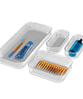 Premium 4 Piece Clear Bin Storage Set For Office, Kitchen, And Home With Soft Grip Lining And Non Slip Base shown with toiletries inside.