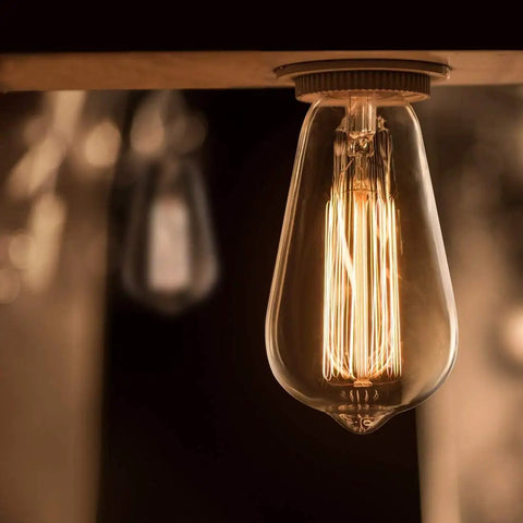Close-up of Vintage Edison Bulbs 60W Amber Warm Dimmable Incandescent E26 Base For Wall Sconce And Chandelier In Retro Fixtures Old School Glow And Cozy Mood Lighting 8-Pack