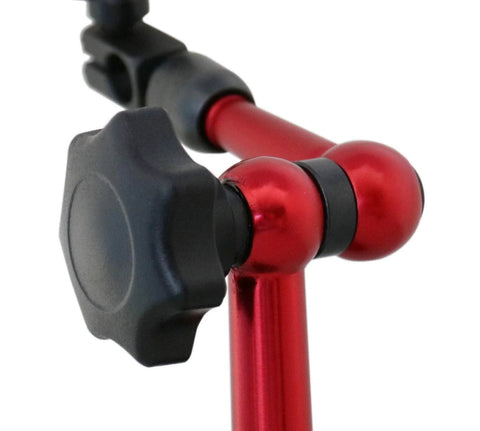 Close-up of red anodized dial indicator stand with black adjustment knob and ball joints