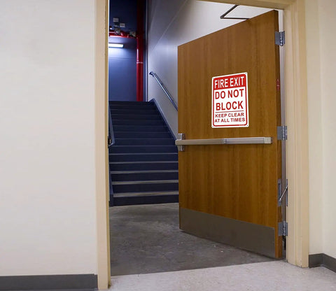 Keep It Clear Fire Exit Sign 10x7 Aluminum Do Not Block Door Weather Resistant Rust Free Easy Mounting 2 Pack High Visibility Red On White For Quick Safety Reminder on a fire exit door