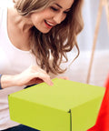 Woman handling Green Corrugated Paper Boxes 10 Pack Go To Heavy Duty Packing Boxes For Shipping And Mailing