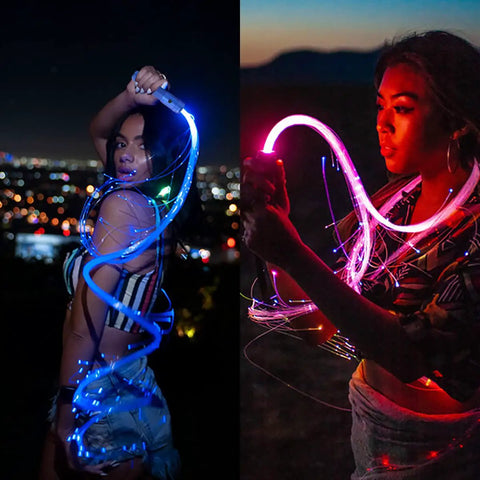 Person using Lit Fiber Optic Space Dancing Light Whip With Rechargeable LED, 5.9Ft Rave Toy, showing dynamic colors and effects at night.