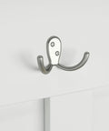 Close-up of a metal hook on Salinas Hall Tree With Shoe Storage Bench In Shiplap Gray And Pure White Workhorse All In One Entryway Organizer