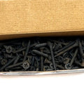 Pro Grade Drywall Screws For Light Gauge Steel Studs Size Six By One And A Quarter Inch in a cardboard box, showing fine thread and bugle heads.