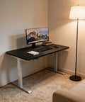 Fly One Touch Electric Rising Desk For Home Office And Gaming Dope Ergonomic Sit Stand Workstation With Silent Motor Smooth Height Adjustments in black finish with monitor and keyboard.