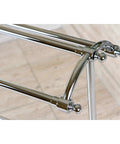 Close-up of a freestanding pedestal towel rack in polished chrome with a triple towel design, featuring durable brass construction.