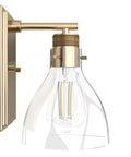 Side view of Alturas Gold 1 Light Sconce In A Medium Size Dimmable Wall Light With Transitional Style showcasing clear glass shade