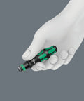 Hand holding Kraftform Kompakt 10 Piece Screwdriver Set with Rapidaptor Bit Holder, ergonomic handle visible.