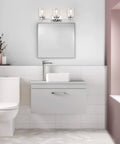 3 Light Chrome Vanity Light Fixtures Over Mirror With Clear Glass Shades in modern bathroom