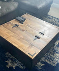Wooden chest featuring black T-strap barn door hinges, showcasing heavy-duty 5-inch iron gate straps for barns and sheds, closed view.