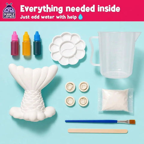 Mermaid Crystal Growing Kit For Kids 6 To 8, STEM Craft Toy That Grows Sparkling Crystals On A Mermaid Tail, Totally Screen-Free, Hands-On Science And Art Project For Young Scientists. Kit parts shown: mermaid tail mold, cups, paints.