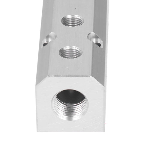 Close-up of Heavy Duty Large Flow Aluminum Pneumatic Air Manifold Block with visible G1/2 inlet and G1/4 outlets for industrial automation.