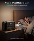 Go-To Portable Power Station 1024Wh LiFePO4 Battery With 2000W AC Outlets And 4500W Peak beside a sleeping person with health device