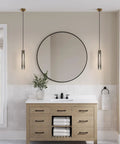 Smokey Crystal Pendant Light In Antique Brass Gold Finish, long tube in bathroom over wooden vanity, mid-century modern style.