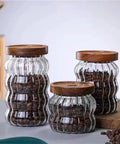 Premium Textured Glass Tea Canisters For Loose Leaf Coffee Beans And Pantry Essentials in three sizes with wooden lids.