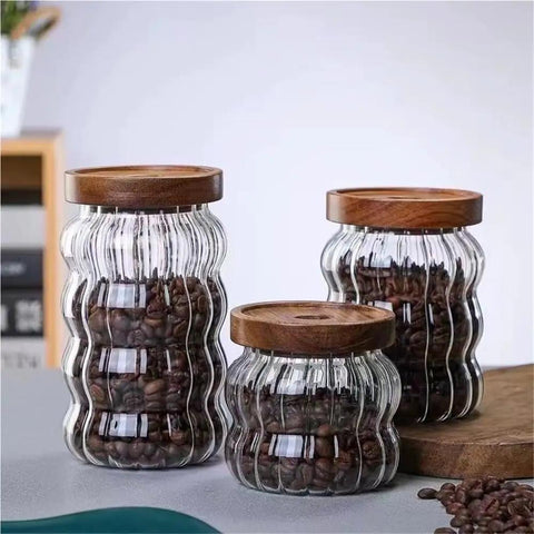 Premium Textured Glass Tea Canisters For Loose Leaf Coffee Beans And Pantry Essentials in three sizes with wooden lids.
