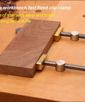 Slick Ace 3/4 Inch Bench Dog Clamps For Woodworking Crews With Rock Solid Stainless Steel Frame securing a wood piece.