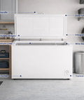 Roomy 14 Cubic Foot Top Load Chest Freezer With Drop Dead Cold features door handle and control panel in garage setting.