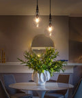 Cozy Farmhouse Seeded Glass Pendant Light With Wooden Teardrop Socket above dining table