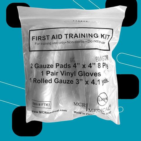 Front view of clear plastic MCR Medical first aid training kit bag with gauze, gloves, rolled gauze
