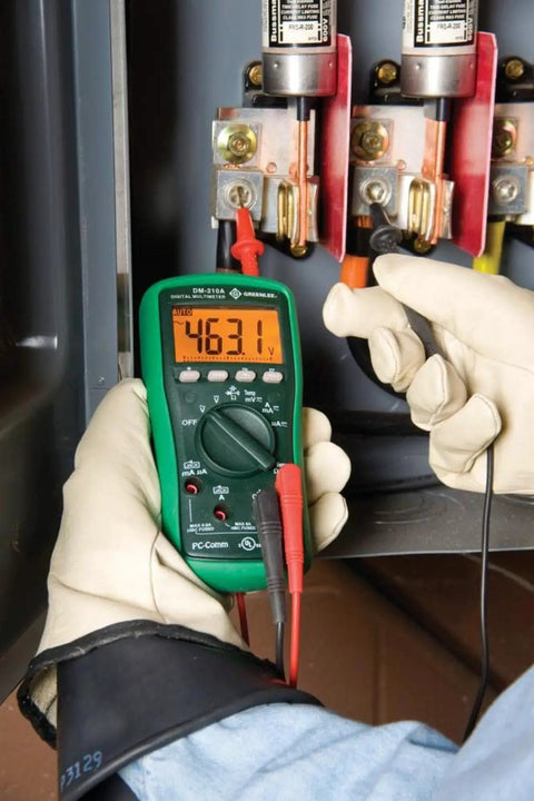 Person using Digital Multimeter With Auto And Manual Ranging And Non Contact Voltage Detection 6000 Count LCD in electrical panel