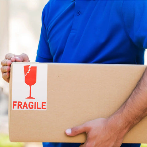 Red Fragile Warning Stickers With Strong Adhesive For Handle With Care Labels On Shipping And Packing Boxes held by person