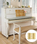 Copper Butt Hinges 4 Pack For Cabinet Doors And Tool Boxes, shown near a vintage white piano and bench.