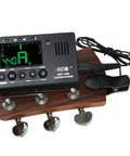 Universal Digital Metronome Tuner with Clip On Microphone for all instruments displayed on guitar headstock