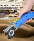 Heavy Duty Electric Scissors And Fabric Cutter Shears For Leather And Cloth With 4500 RPM Power used for cutting leather in a workshop.