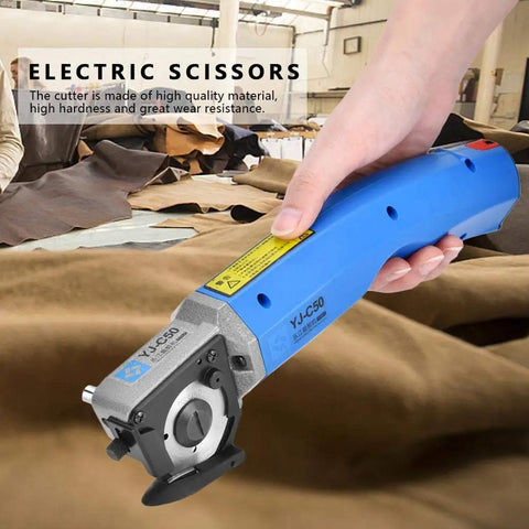 Heavy Duty Electric Scissors And Fabric Cutter Shears For Leather And Cloth With 4500 RPM Power used for cutting leather in a workshop.