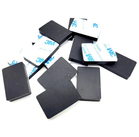 Rectangle Silicone Rubber Bumper Feet One And One Half Inch By One Inch Three Sixteenth Inch Thick Durable Waterproof Adhesive Backing Non Slip Waterproof Pads Glides For Furniture Appliances Electronics Equipment 12 Pack, showing adhesive backing.