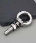 Four Pack Stainless Steel Lifting Eye Bolts And Washers M8 X 35Mm For Ifor Williams Horsebox Trailers, close-up of bolt on slate surface.