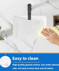 Person cleaning compact white porcelain undermount bathroom sink for small bathrooms and RVs rectangular ceramic basin