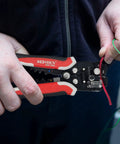 Person using Automatic Wire Stripper Pliers With Self-Adjusting 3-In-1 Function for Stripping Crimping and Cutting 10-24 AWG Wires
