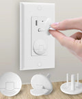 Hand installing Outlet Covers White 38 Pack Baby Proofing For Electrical Outlets, Child Safety Socket Plugs on a wall socket.
