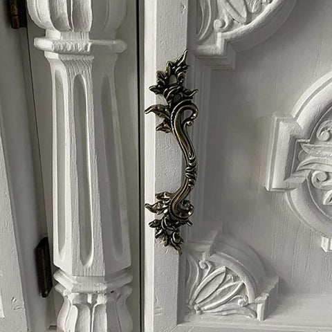 Side view of Five Piece Antique Bronze Drawer Handle Set 6.61 Inch Vintage Cabinet Pulls on white decorative furniture