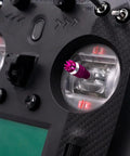 Close-up of Ultra Reliable 2.4 GHz RC Transmitter with 8 to 10 Channels, showing control sticks and dual antennas for drones and cars.