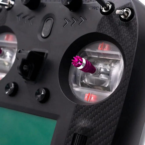 Close-up of Ultra Reliable 2.4 GHz RC Transmitter with 8 to 10 Channels, showing control sticks and dual antennas for drones and cars.