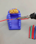 Blue Heat-Resistant Silicone Soldering Wire Holder with 6 Grooves, brass wool cleaner, and wires being soldered.