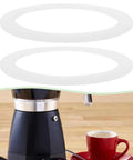 Stovetop Espresso Maker Silicone Gasket Six Pack Replacement Seal Ring Compatible With Bialetti Moka Express 9 Cup Imusa 9 Cup Pots And BC 9 Cup Models Durable Coffee Pot Gasket Set visible with espresso maker and cup of coffee