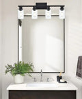 Industrial Indoor Four Light Bathroom Vanity Light In Black With Clear Glass Shades mounted above bathroom mirror and sink