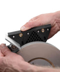 Hands holding Pro-Grade Scissors Sharpening Jig With 60 Degree Angle For Fast, Precise Sharpening On Your Sharpening System
