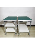 Side view of Heavy Duty Adjustable ESD Workbench With Wheels, showing two aluminum rolling tables with green surfaces.