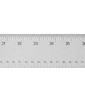 Close-up of Stainless Steel Ruler With Non Slip Cork Base 6 Inch For Pro-Grade DIY Crafting And Drafting Warp Free And Bend Resistant Measuring Tool With Easy Read 1/16 And Metric Markings For Clarity, showing etched markings.
