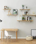 Rugged Triangle Shelf Bracket For Open Shelving Built Hella Solid With Matte Iron Wall Brackets arranged with decorative items.