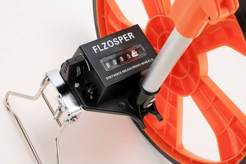Go-To Measuring Wheel Portable Three Fold 13 Inch Wheel For Distance And Surveying Measures Up To 9,999.9 Feet Durable ABS Body With Wear Resistant Rubber Handy Orange measuring wheel counter close-up