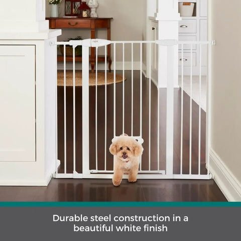 Extra Tall Walk Thru Pet Gate For Large Dogs With Adjustable Pass Through Door Pressure Mounted Safety Barrier No Sweat Setup Wide White Metal Dog Fence Rock Solid And Built Tough with a small dog passing through.