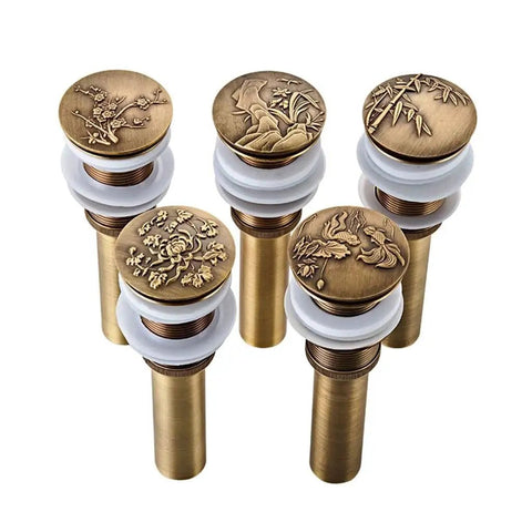 Copper Wash Basin Drain Plug, With drain hole, With drain hole A with intricate designs and a gold finish suitable for sinks.