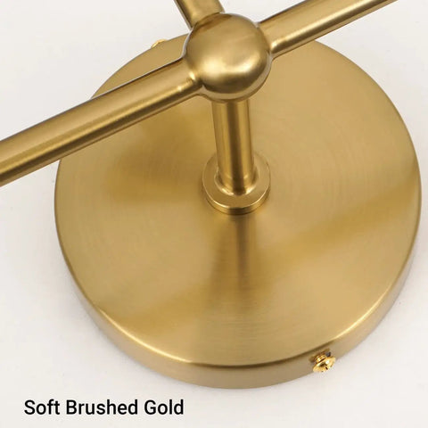 Close-up view of the base of Dope Mid Century 3 Light Vanity Fixture With Smooth Brushed Gold Finish.